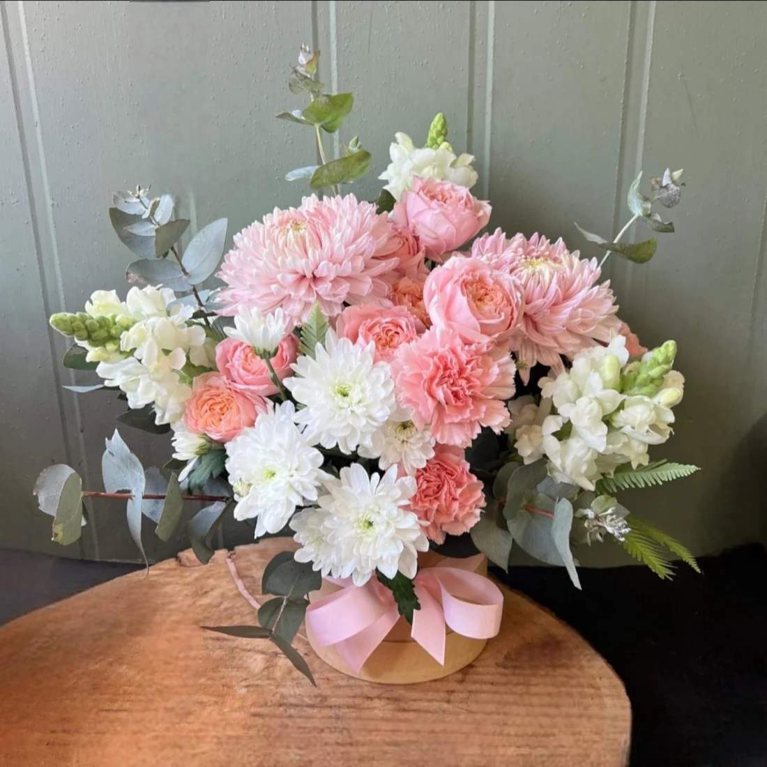 pink and white flowers in a box