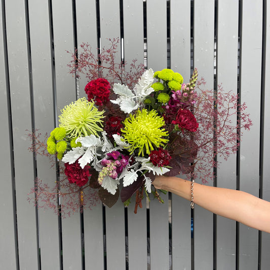 Green red and silver flower bouquet